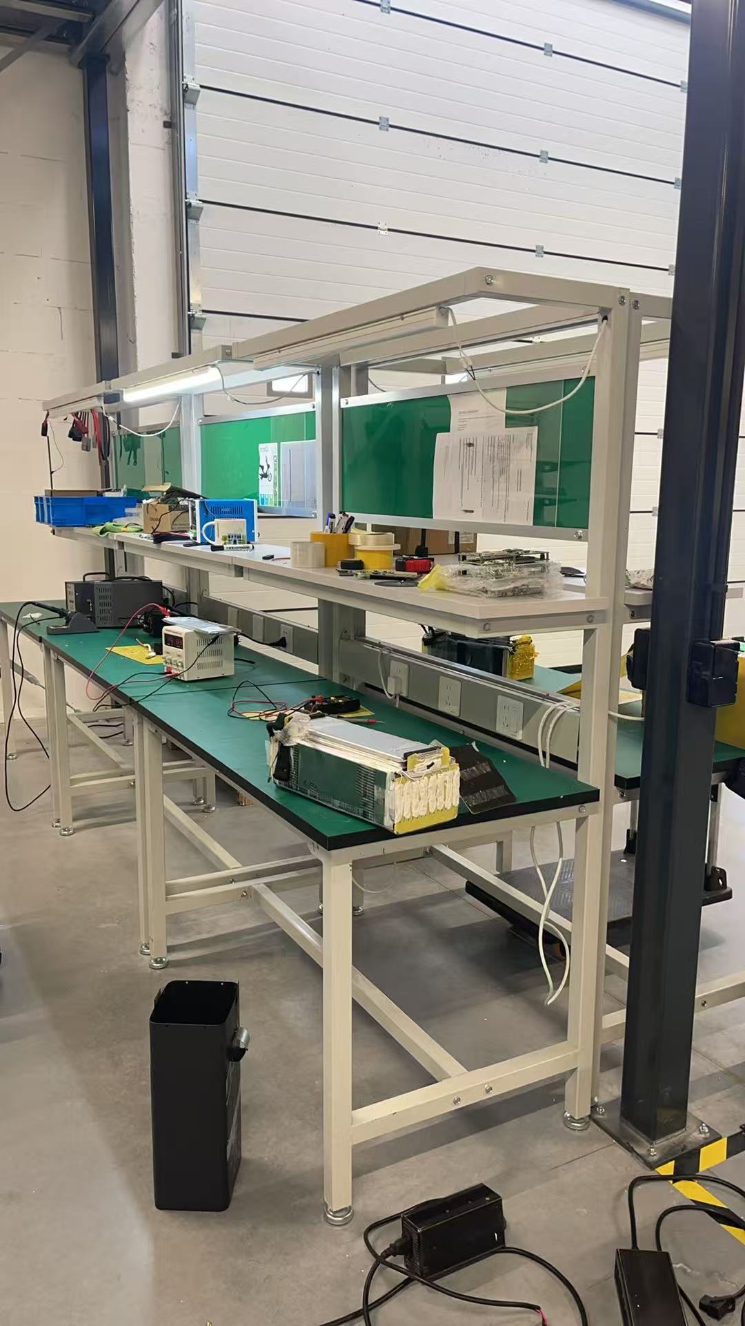 Technician testing battery components